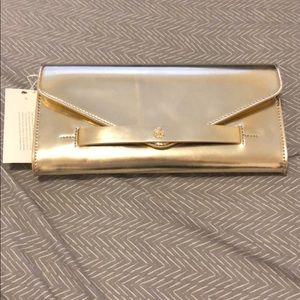 Brand New - never worn Tory Burch gold clutch